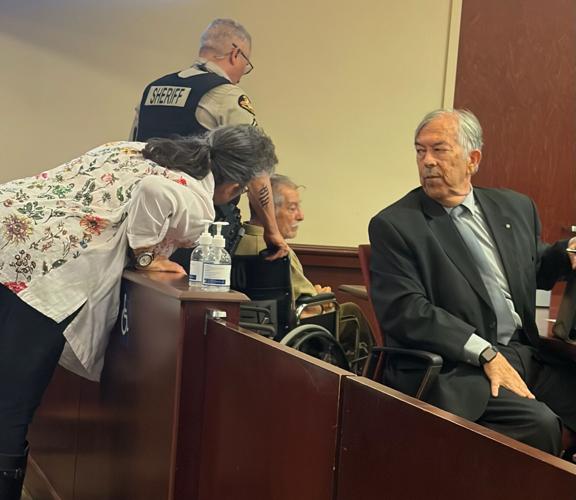 Marsha Chavez speaks to Ben Noverto Martinez during a June 15 hearing as Stephen Aarons looks on.